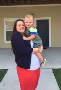 Cassondra Smith stands with her young son outside of her apartment at the Scholar House in Pikeville. Smith participated in Big Sandy Area Community Action Program’s In-School Youth Program and was a recent recipient of the Community Services Block Grant Scholarship.